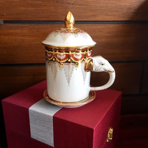 Elephant Mug with Lid & Saucer: Hand-Painted, Gold Accents | Drinkware by Artisan Homeware. Item made of ceramic