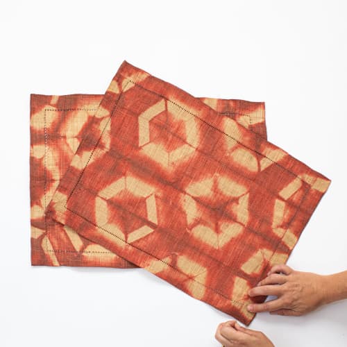 Raffia Shibori Placemat Pair - Turtle Pattern - Terra Cotta | Tableware by Tanana Madagascar. Item made of fabric with fiber