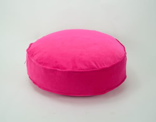 Pink round velvet store cushion