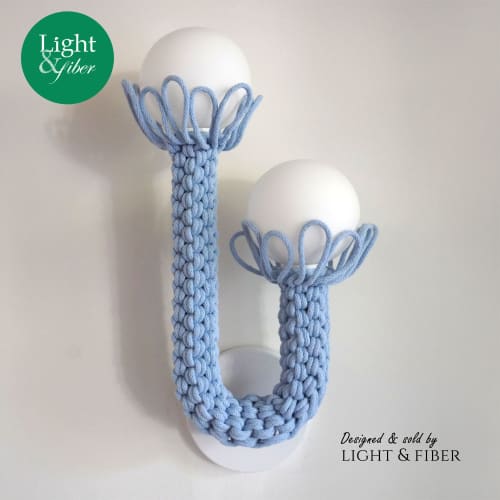 Baby Blue Sculptured Sconces with Glass bubbles | Sconces by Light and Fiber. Item made of steel with glass works with mid century modern & contemporary style