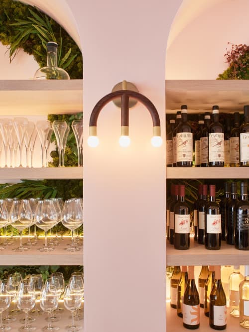 Wall Mount Light CROWN | Sconces by HACHI COLLECTIONS | Ginza Brasserie Grand Bleu in Chuo City. Item made of walnut with brass