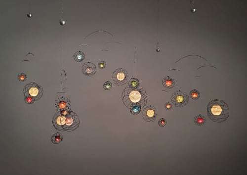 Orbs Suspended Lights Installation | Lighting Design by Claudine Gevry Studio | Salari Fine Carpets in Vancouver. Item composed of copper