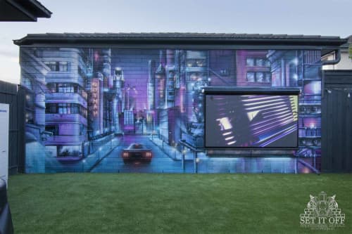 Cityscape Mural X Outdoor Cinema | Street Murals by Set It Off Murals. Item composed of synthetic