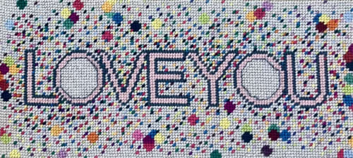 hand-embroidered needlepoint LOVE YOU original pillow | Pillows by Mommani Threads. Item composed of wool in contemporary or eclectic & maximalism style