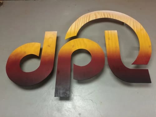 DPL logo | Murals by Christian Toth Art | DPL in Moncton. Item composed of wood and synthetic