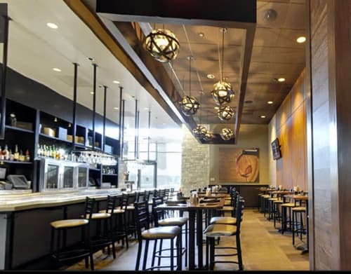 Orbits | Pendants by Stil Novo Design | Cooper's Hawk Winery & Restaurant in Town and Country. Item composed of steel