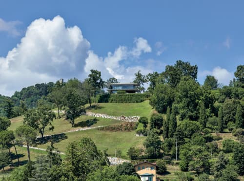 Teca House | Architecture by Federico Delrosso Architects. Item composed of wood & stone