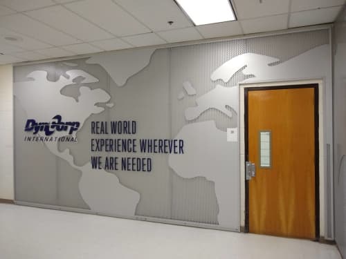 DynCorp International | Signage by Jones Sign Company. Item composed of metal and synthetic