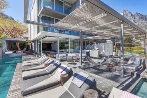 Studio Stirling Circular Wheel Chair in the POD Hotel | Swing Chair in Chairs by Studio Stirling | POD Camps Bay in Cape Town. Item composed of steel in minimalism or contemporary style