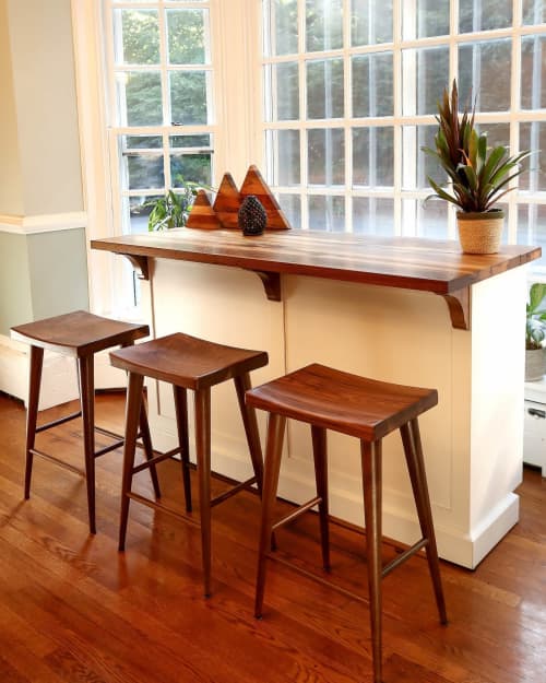 Mid-Century Modern Saddle Stool | Bar Stool in Chairs by The Strong Oaks Woodshop. Item composed of walnut in minimalism or mid century modern style