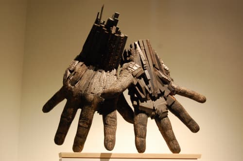 Paired Hands, Black | Sculptures by Andrew Ramiro Tirado | DoubleTree by Hilton Greeley at Lincoln Park in Greeley. Item composed of wood