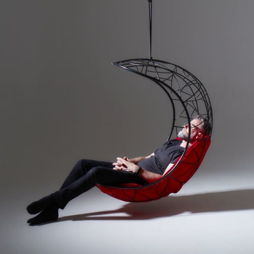 Studio Stirling - Lucky Bean at Design Joburg 2022 | Swing Chair in Chairs by Studio Stirling | Sandton Convention Centre in Sandton. Item made of steel & leather compatible with minimalism and modern style