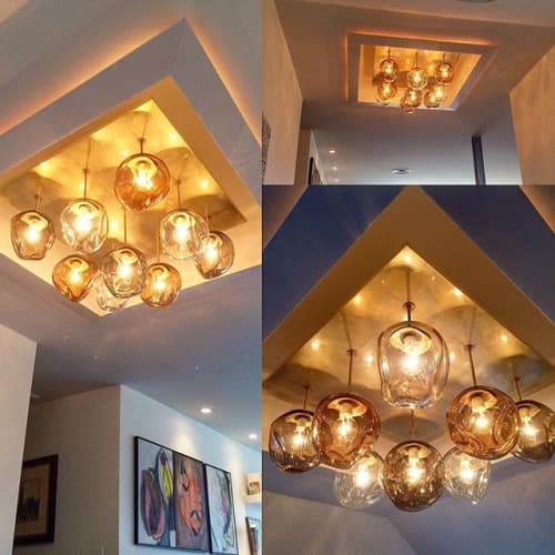 Parkside | Chandeliers by Hyland Glass. Item made of brass with glass