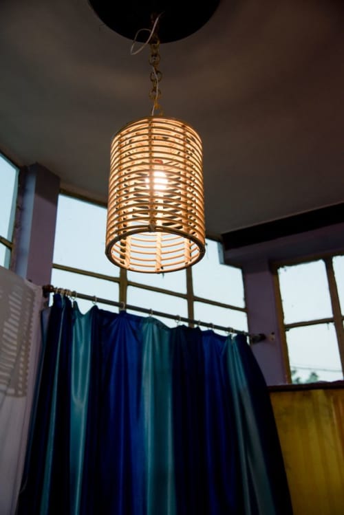 Handmade Rattan Oval Hanging Lampshade | Pendants by Amara. Item composed of wood in boho or mid century modern style