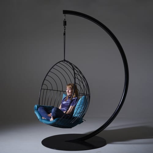 Half Circle Stand with Bubble at WMC Fair | Swing Chair in Chairs by Studio Stirling. Item made of steel works with minimalism & contemporary style