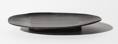 Ollie - Satin Black | Plate in Dinnerware by Len Carella. Item composed of stone