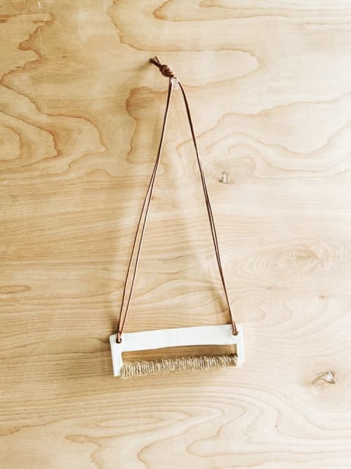 Horizontal Wall Hanging | Wall Sculpture in Wall Hangings by Bridget Dorr. Item composed of ceramic and leather