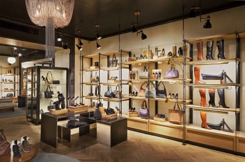 Perimeter Shelving System | Storage by Amuneal | Cole Haan in New York. Item composed of wood and metal