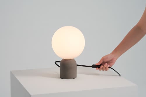 CASTLE GLO Table Lamp | Lamps by SEED Design USA. Item composed of concrete and glass