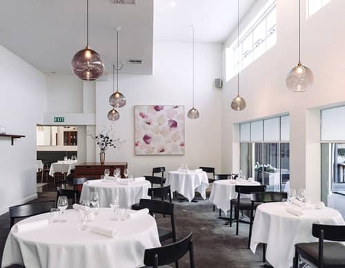 Petals Blush Artwork | Oil And Acrylic Painting in Paintings by Emma Hayes | Sid at The French Cafe in Auckland. Item composed of synthetic