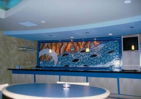 Mosaic Mural - Crescent, River, Fire | Public Mosaics by Gila Mosaics Studio | Smoothie King Center in New Orleans. Item composed of ceramic and glass
