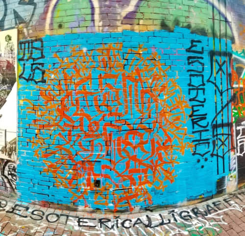 Orange Graffiti | Street Murals by ESOTERiC Calligraffiti. Item composed of concrete and synthetic
