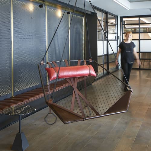 Studio Stirling Angular Sling Hanging Swing Seat | Swing Chair in Chairs by Studio Stirling | MESH Club in Johannesburg. Item composed of steel & leather