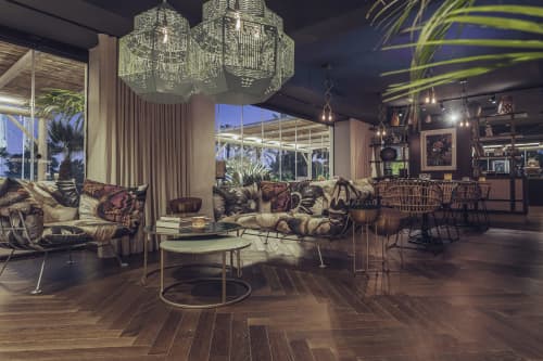 Caged Beauty | Chandeliers by JSPR | Boho Club Restaurant in Marbella. Item made of steel