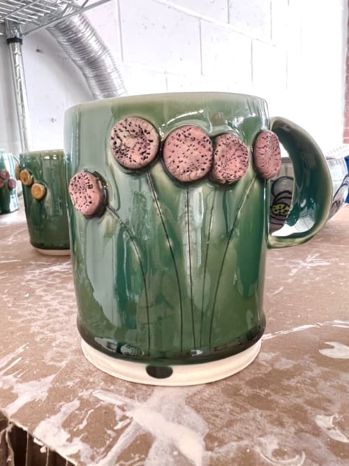 Porcelain mug with hand sculpted flowers and custom glaze | Drinkware by Liz Noonan Ceramics. Item made of stoneware