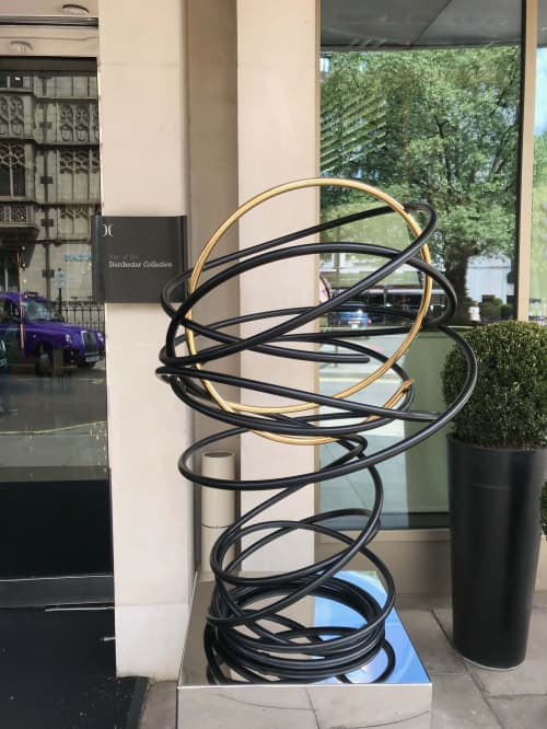 Gold in Black Tall Spiral | Public Sculptures by Mark Beattie MRSS | 45 Park Lane in London. Item made of copper