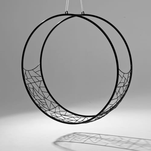 Modern Wheel in the Celebrity Edge Cruise | Swing Chair in Chairs by Studio Stirling. Item made of steel works with minimalism & coastal style