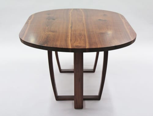 Oval walnut table, Trapeze leg, with book-matched top. | Dining Table in Tables by Jonathan Field. Item composed of walnut