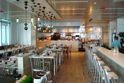RailroadWare Insulator Light Array | Chandeliers by RailroadWare Lighting Hardware & Gifts | Icebox Cafe in Miami Beach. Item composed of glass
