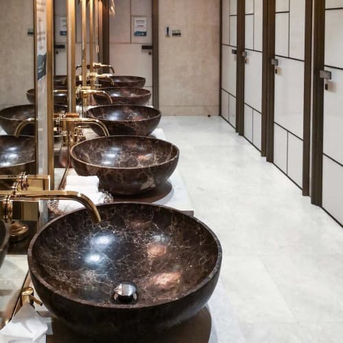 Round Washbasins | Water Fixtures by Kreoo | Muscat International Airport in Muscat. Item composed of marble
