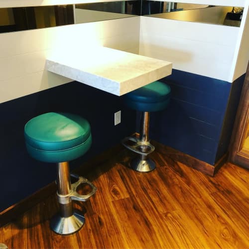 Floor Mounted Bar Stools - Model 6050-302 | Chairs by Richardson Seating Corporation | Bluewater Grill in Santa Barbara. Item composed of brass and leather