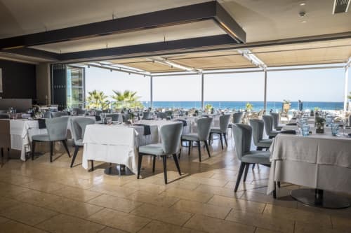 Curved Fabric Dining Chair By Anesis Comfortable Designs Seen At Atlantica Kalliston Resort And Spa Chania Wescover