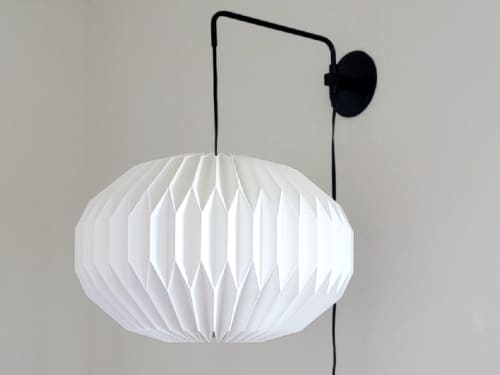 Industrial sconce with pleated elliptical lampshade | Sconces by Studio Pleat. Item made of metal with paper works with mid century modern & contemporary style