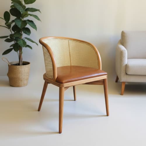 Vera Woven Rattan Back Dining Chair | Chairs by Kleinhaus Furniture. Item made of wood with fabric works with boho & mid century modern style