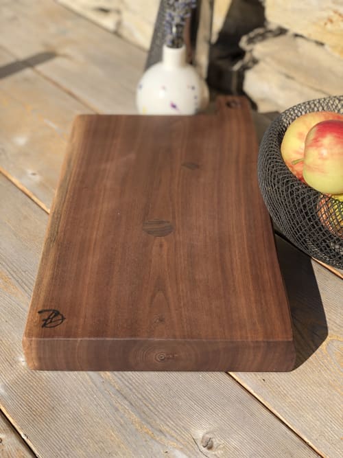 Live Edge Black Walnut Board with circle inlays | Serveware by Patton Drive Woodworking. Item composed of walnut