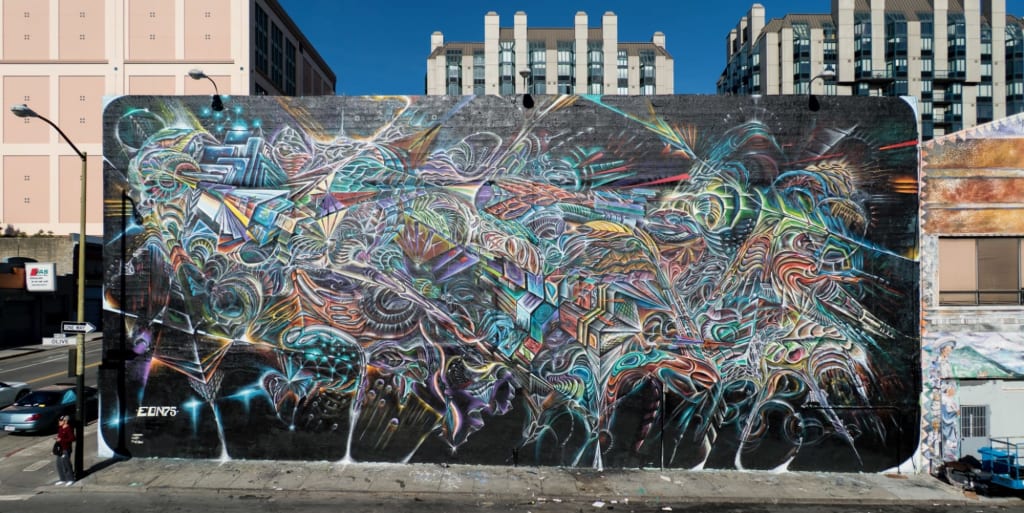 Free form, multicolored, organic street mural by Max Ehrman Eon75 at Mitchell Brothers in San Francisco.