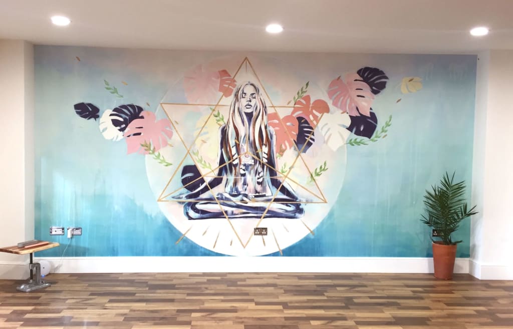 custom indoor blue and white wall mural of woman in lotus position