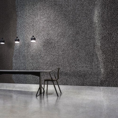 TIDES is inspired by the graduated textures of sand, pebble, and water.
