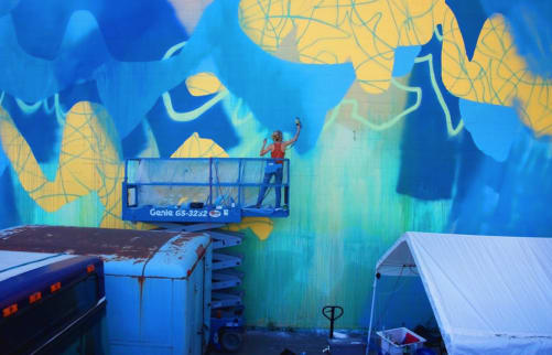 Yellow and blue abstract street mural by Nicole Mueller in the Dogpatch neighborhood in San Francisco