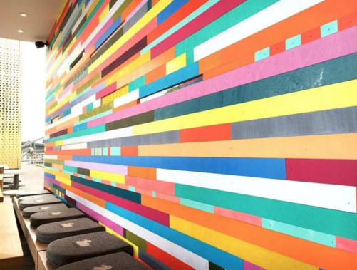 Color Wall mural striped wall by Leah Rosenberg in a Hamburg restaurant
