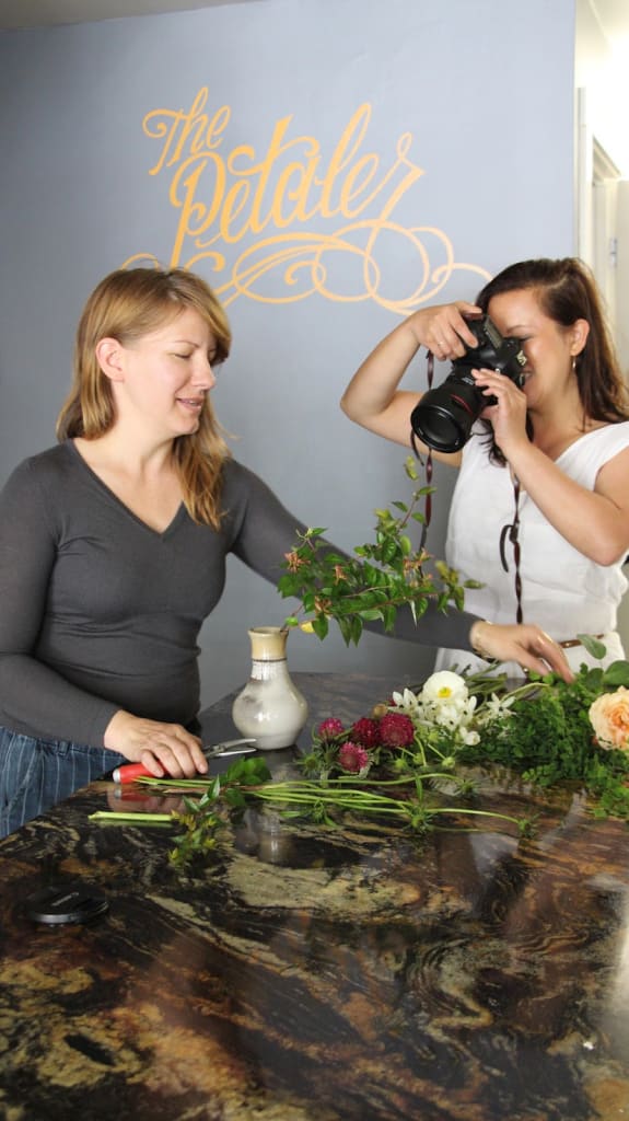 Rebekah jushes florals as Leslie wields her camera