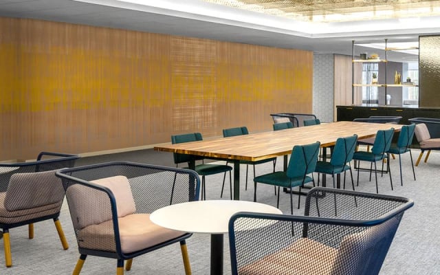Reflections in Honeygold, a non-repeating mural that spans across a 125 ft wall at the JPMorgan Chase Headquarters on Park Avenue. The abstract layering on non-repeating colors help to break up the space and add visual interest.