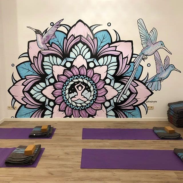 colorful mandala purple and blue wall mural with birds and flowers at a yoga studio