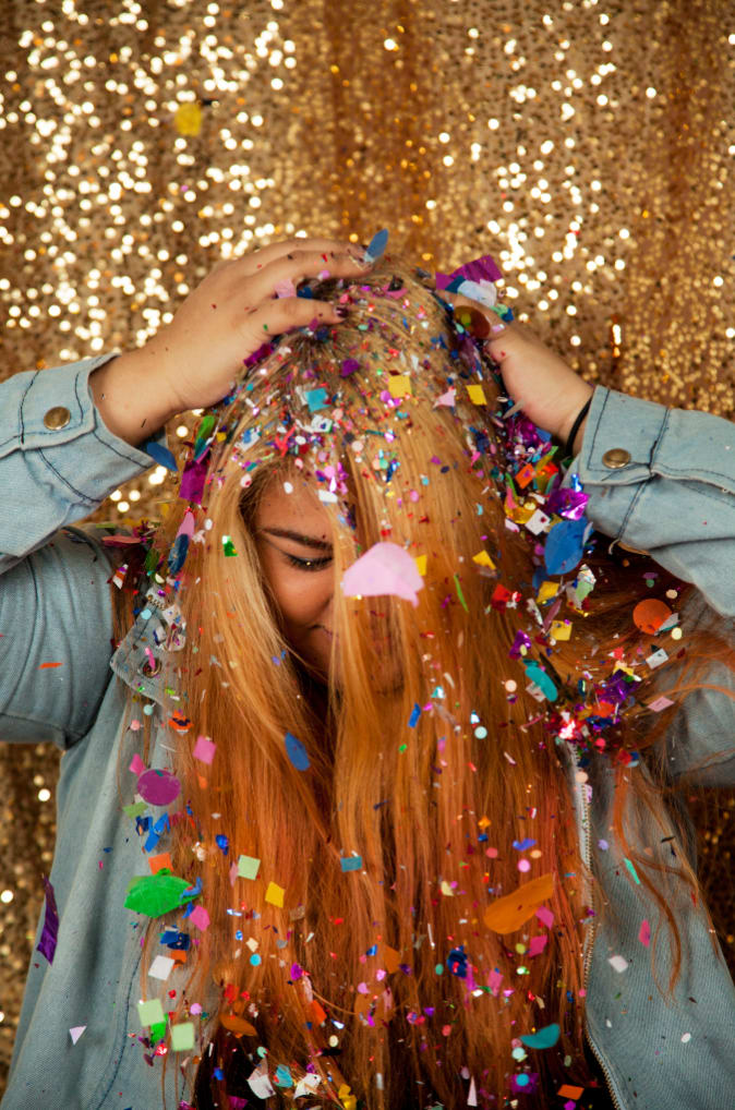 Amanda Espiritu with confetii in her hair, profile photo for Wescover.