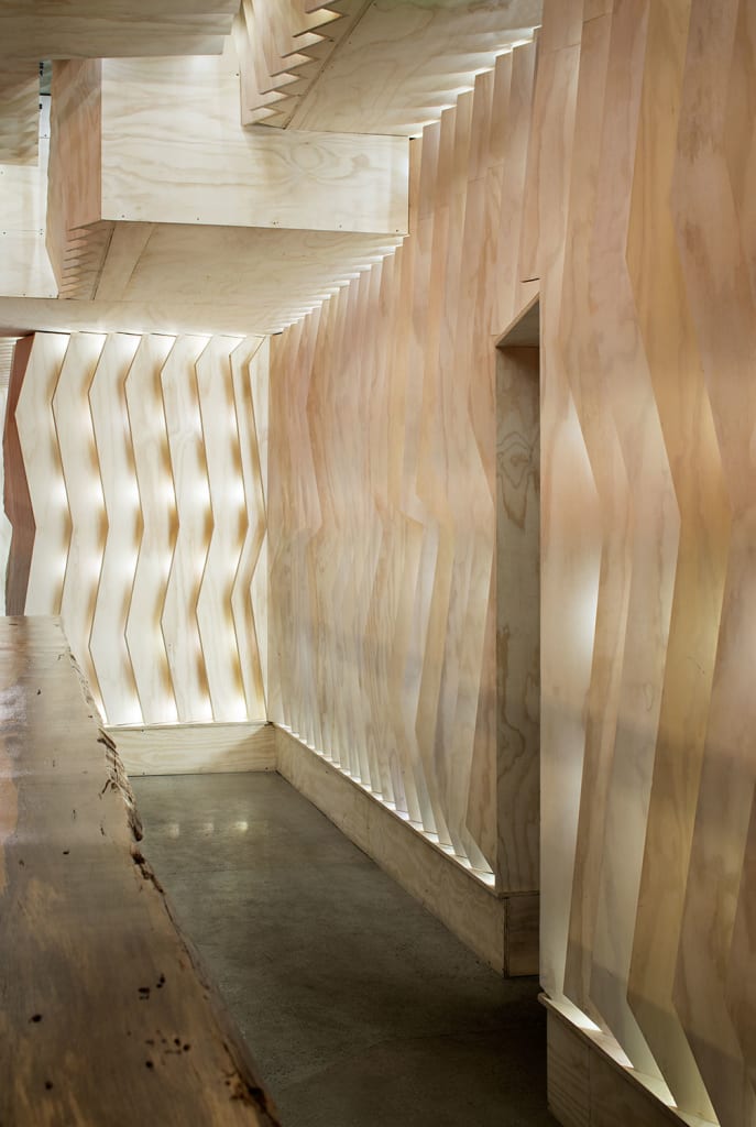 Basile Studio's unique design of Underbelly ramen restaurant includes overlapping plywood panels to resemble the gills of a fish. Photo By Zack Benson.
