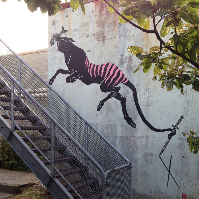 tiger art of a Tasmanian Tiger mural in Queenstown, Australia by Creature Creature